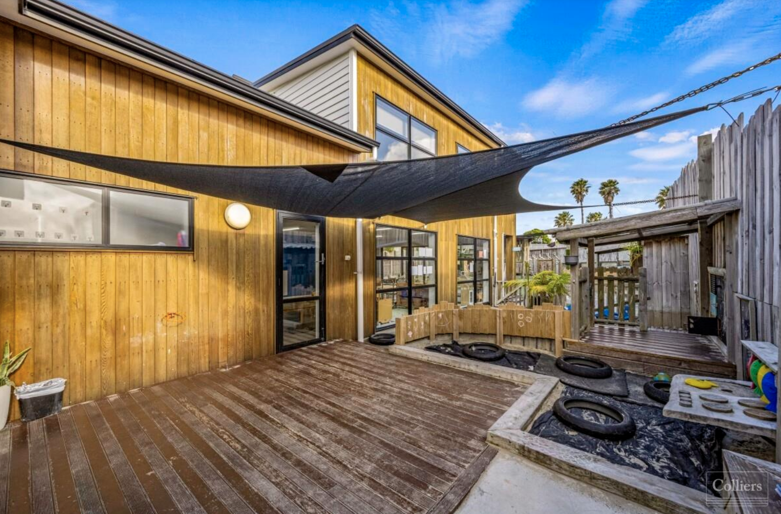 Covered deck and outdoor dining area at The Village Co ELC